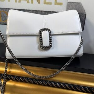 Marc Jacobs The St. Marc Chain Wallet is a white leather crossbody bag